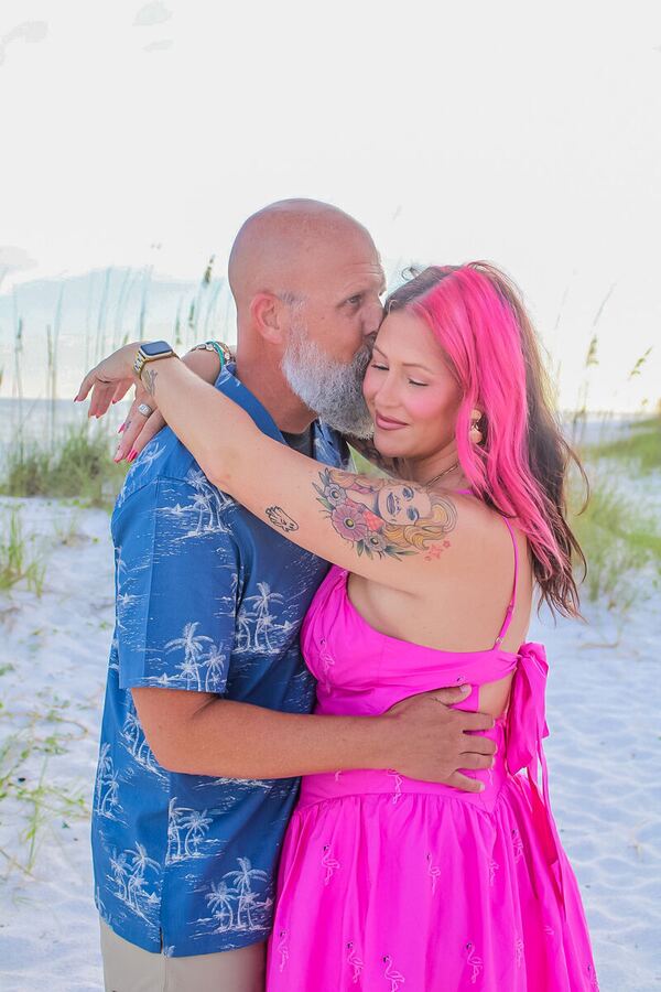 Couple sharing a kiss on the beach